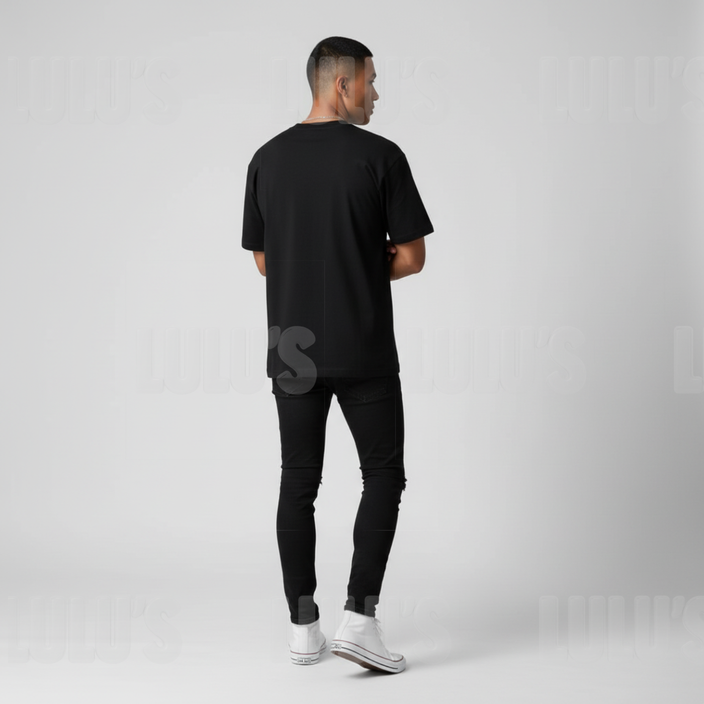 Male model wearing the black Rujinu T shirt shown from behind with relaxed fit.