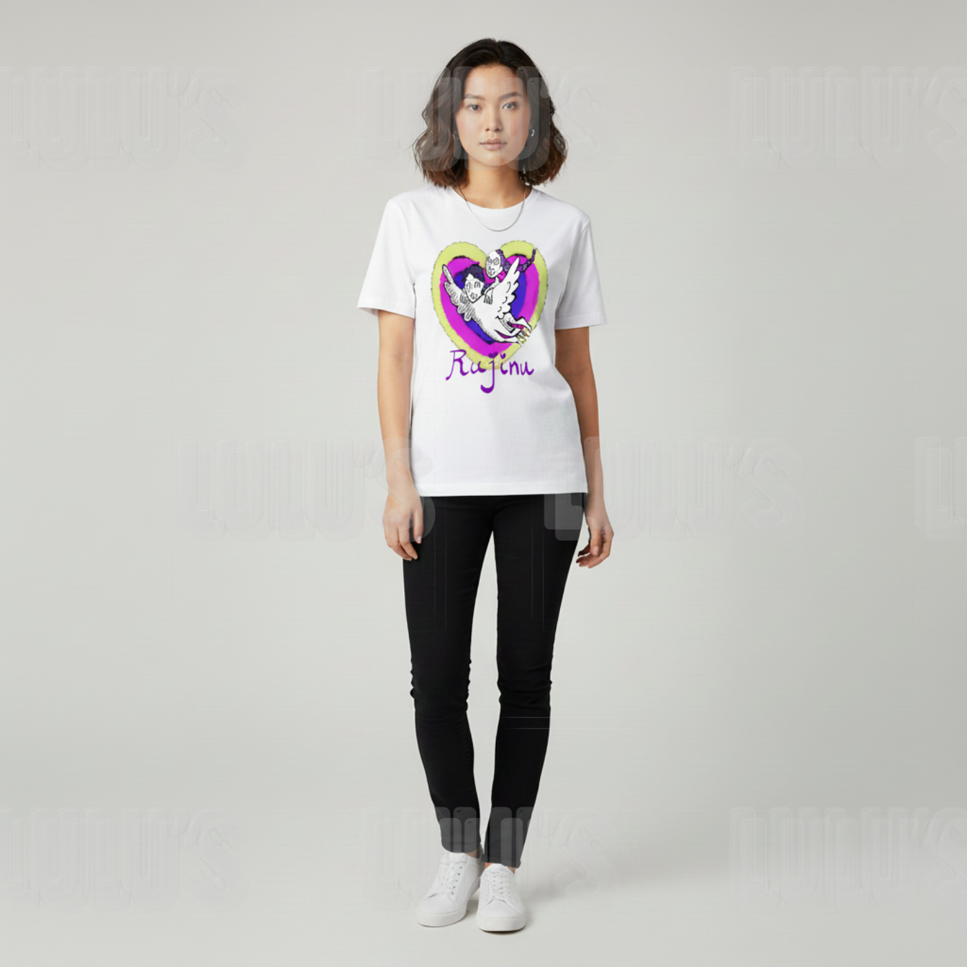 Front view of female model wearing the white Rujinu T shirt styled with skinny black jeans and trainers.