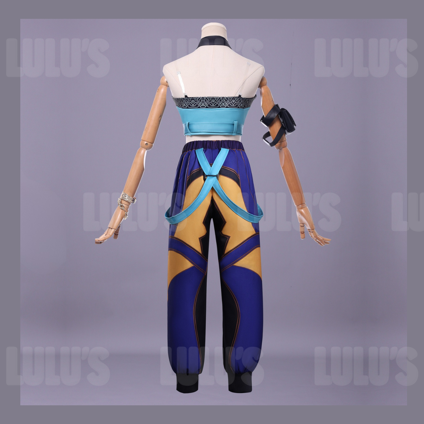 Back view of K-Pop Demon Hunters Zoe cosplay costume with blue strapped crop top and purple pants featuring gold accents and adjustable suspenders.