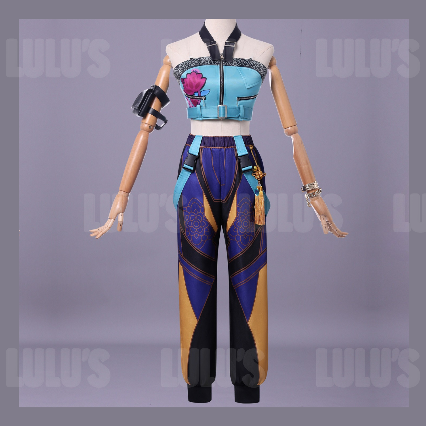 Full front view of Zoe cosplay costume from Netflix K-Pop Demon Hunters, featuring blue lotus crop top, purple patterned pants, tassel belt, and arm pouch.