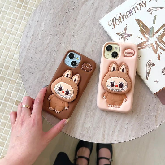 Labubu Silicone Phone iPhone Case Telescopic Stand Pressed Cream and brown On a Desk