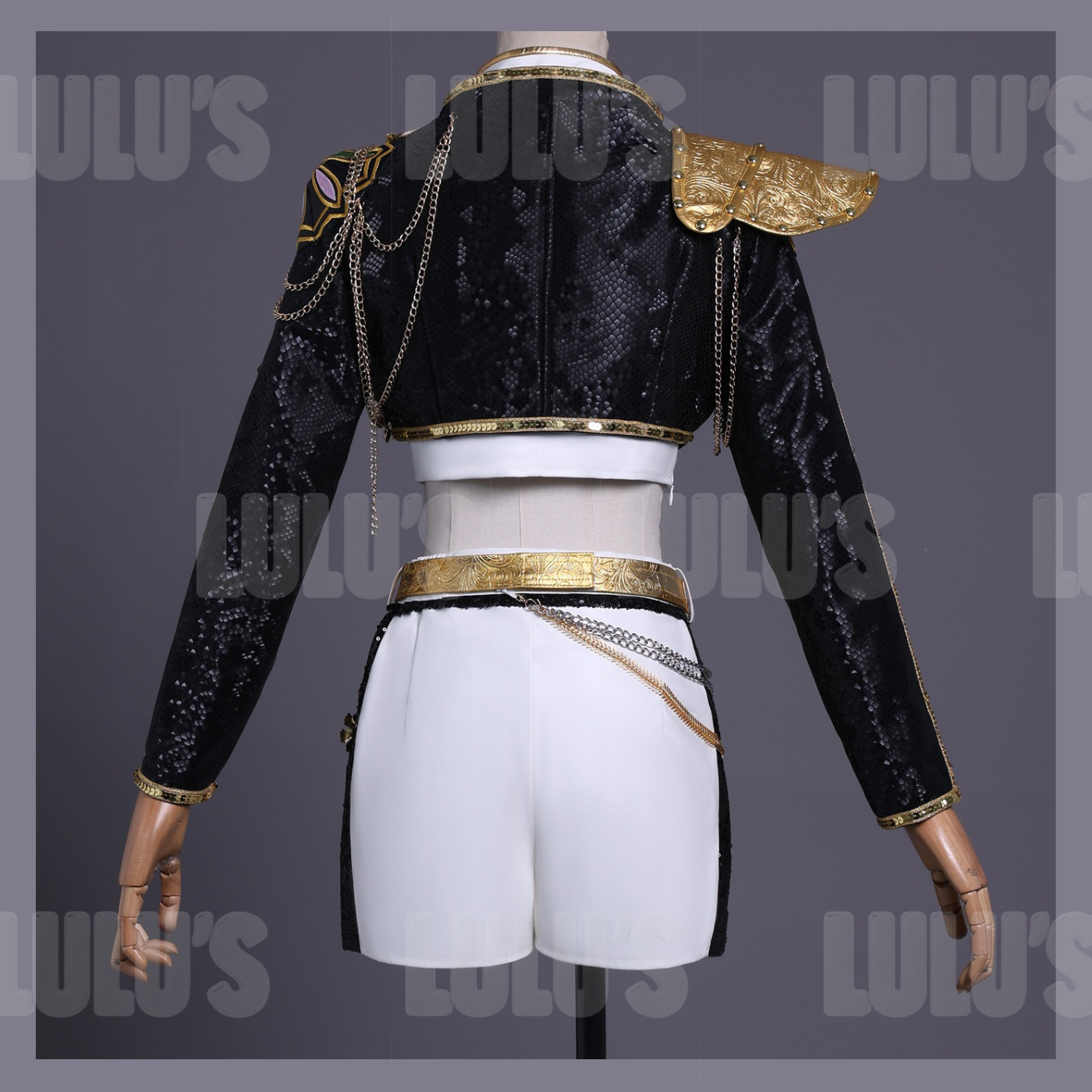 Back view of Rumi Black and Gold cosplay costume from K-pop Demon Hunters Golden, featuring cropped black sequin jacket, white skirt, and gold sash