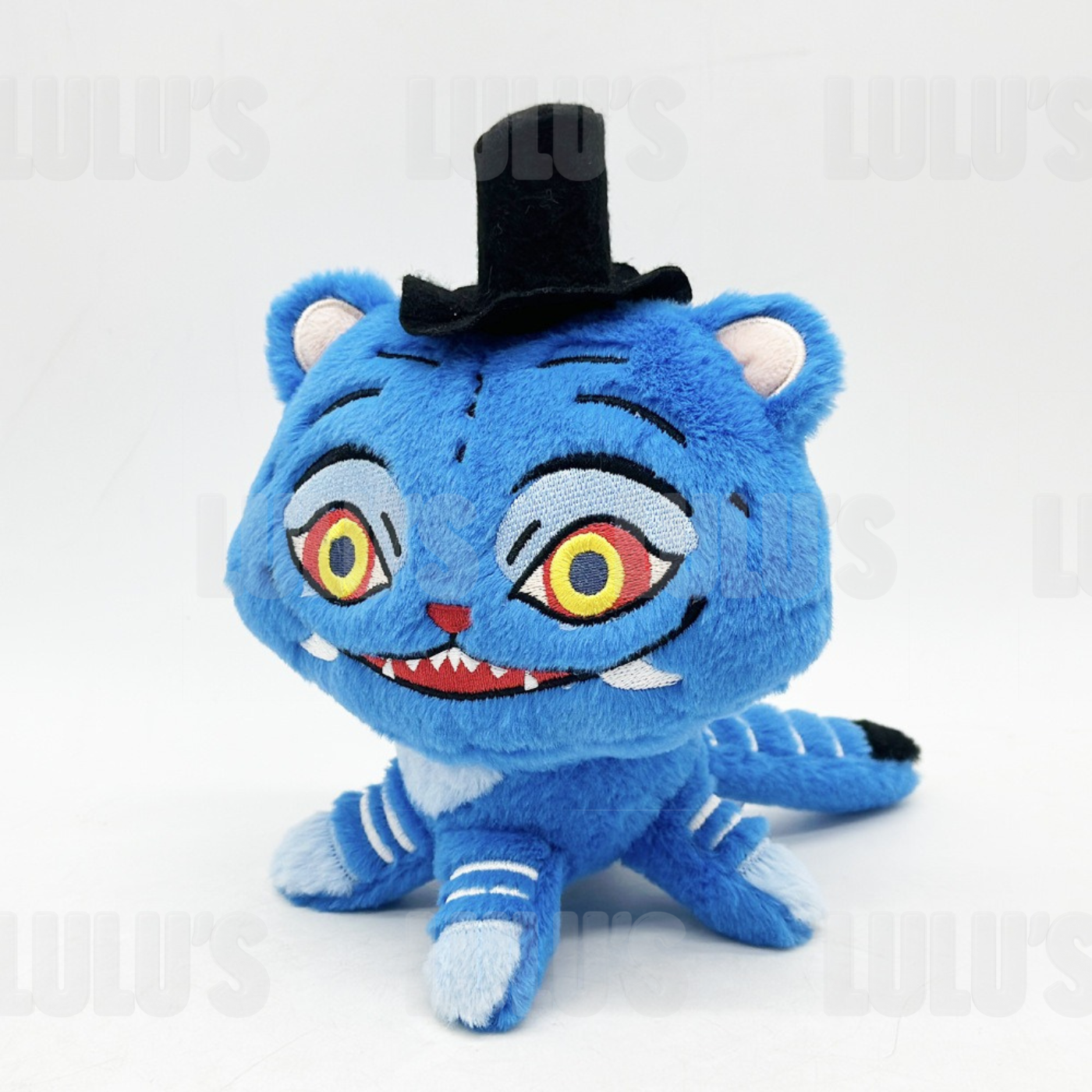Front view of Derpy Cat plush showing wide embroidered yellow and red eyes, toothy grin and soft blue fur.