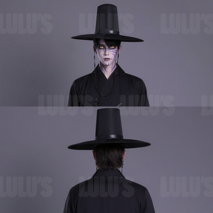 Detailed closeup of hat string beads fabric texture and silver chain accessories from Jinu costume