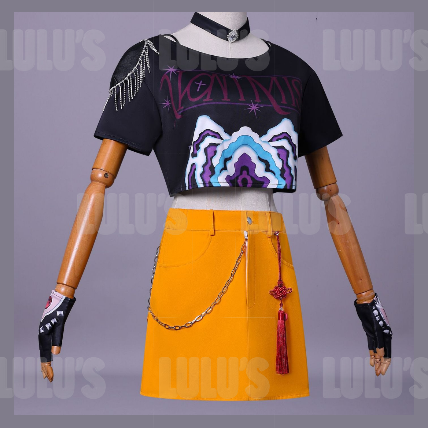 Front mannequin view of Mira cosplay costume with black crop top, yellow skirt, red tassel accessory, purple leggings, and character gloves.